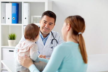 Image showing happy woman with baby and doctor at clinic