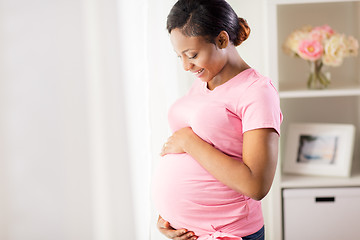 Image showing happy pregnant woman with big belly at home