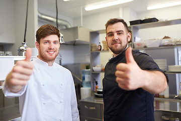 Image showing chefs at restaurant kitchen showing thumbs up