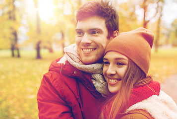 Image showing happy young couple walking in autumn park