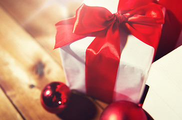 Image showing close up of gift boxes and red christmas balls