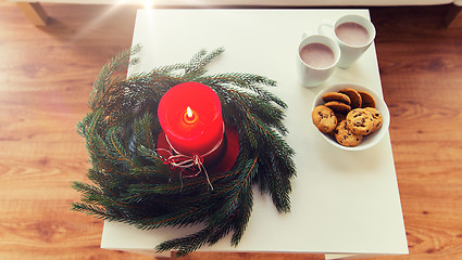 Image showing close up of christmas wreath with candle on table