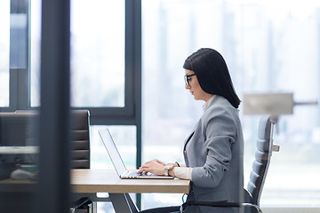 Image showing businesswoman using a laptop in startup office