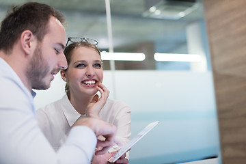 Image showing Business People Working With Tablet in startup office