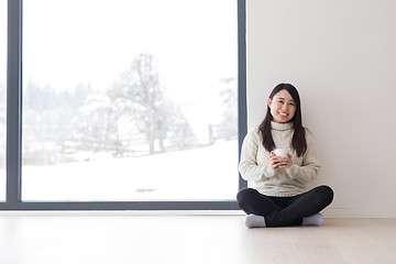 Image showing asian woman enjoying morning coffee