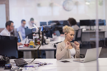 Image showing businesswoman using a laptop in startup office