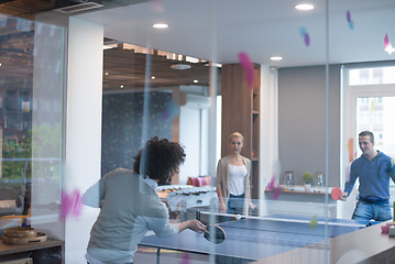 Image showing startup business team playing ping pong tennis