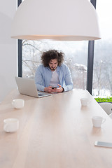 Image showing Young casual businessman using smartphone