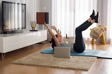 Image showing Doing exercise at home