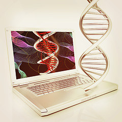 Image showing Laptop with dna medical model background on laptop screen. 3d il