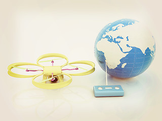 Image showing Quadrocopter Drone with Earth Globe and remote controller on a w