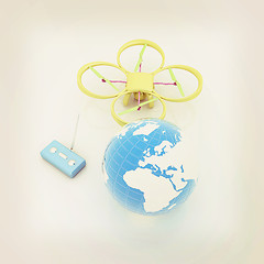 Image showing Quadrocopter Drone with Earth Globe and remote controller on a w