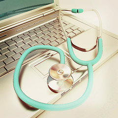 Image showing silver laptop diagnosis with stethoscope. 3D illustration. Vinta