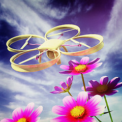 Image showing Drone, quadrocopter, with photo camera against the sky and Beaut