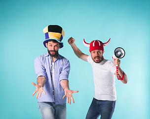 Image showing Two Excited Male Friends Celebrate Watching Sports