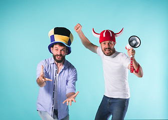 Image showing Two Excited Male Friends Celebrate Watching Sports