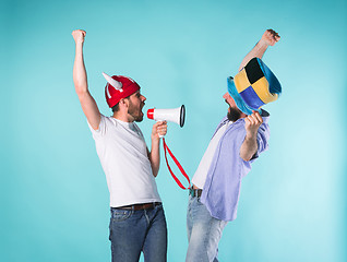 Image showing Two Excited Male Friends Celebrate Watching Sports