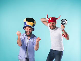 Image showing Two Excited Male Friends Celebrate Watching Sports