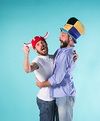 Image showing Two Excited Male Friends Celebrate Watching Sports