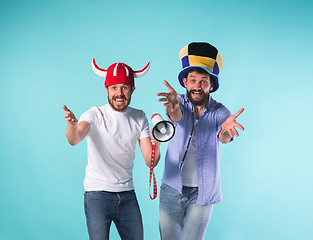 Image showing Two Excited Male Friends Celebrate Watching Sports