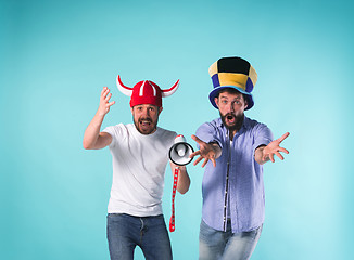 Image showing Two Excited Male Friends Celebrate Watching Sports