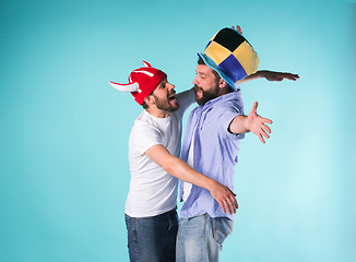 Image showing Two Excited Male Friends Celebrate Watching Sports