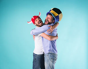 Image showing Two Excited Male Friends Celebrate Watching Sports