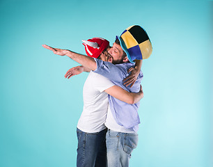 Image showing Two Excited Male Friends Celebrate Watching Sports