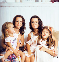 Image showing Mature sisters twins at home with little daughter, happy family