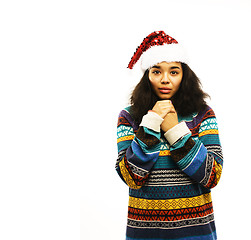 Image showing cute young girl in santas red hat isolated