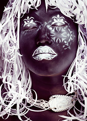 Image showing creative makeup like Ethiopian mask, white pattern on black face