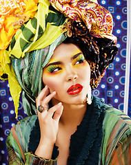 Image showing beauty bright woman with creative make up, many shawls on head l