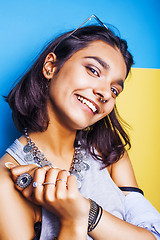 Image showing lifestyle people concept. young pretty smiling indian girl with long nails wearing lot of jewelry rings, asian summer happy cool