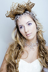 Image showing beauty young snow queen with hair crown on her head, complicate 