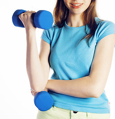 Image showing young pretty brunette woman with blue dumbbell isolated cheerful smiling, part of body, diet people concept on white background