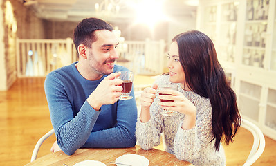 Image showing happy couple drinking tea at cafe