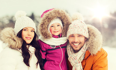 Image showing happy family with child in winter clothes outdoors