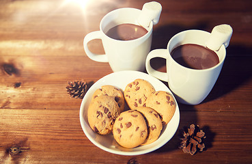 Image showing cups of hot chocolate with marshmallow and cookies