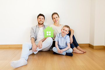 Image showing happy family with green house moving to new home