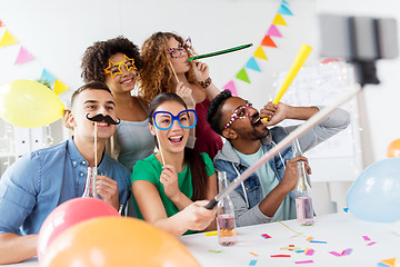 Image showing happy team taking selfie at office party