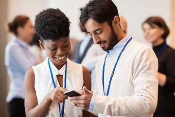 Image showing couple with smartphone at business conference