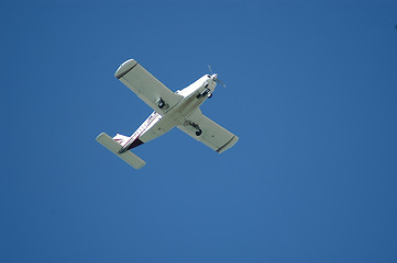 Image showing Small airplane over blue sky