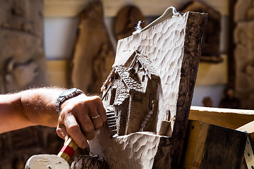 Image showing Sculptor hands working wood