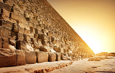 Image showing Fiery sunset and pyramid