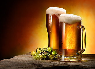 Image showing Two glasses of beer and hops