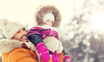 Image showing happy family in winter clothes outdoors