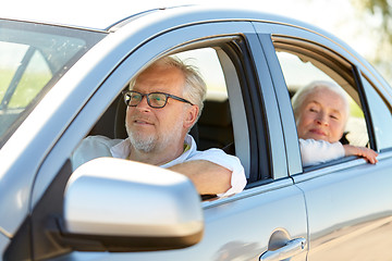 Image showing happy senior couple driving in car