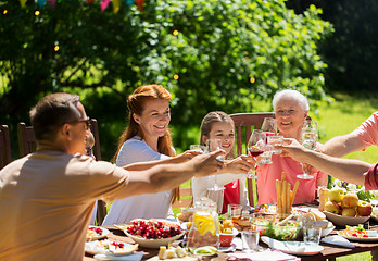 Image showing happy family having dinner or summer garden party