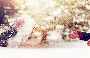 Image showing happy friends playing with snow in winter