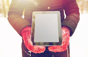 Image showing close up of woman with tablet pc in winter